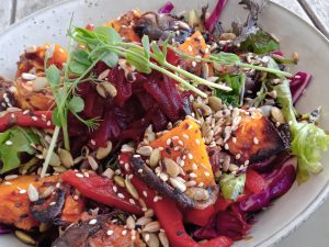 nutrient-rich salad roasted pumpkin spinach microgreens